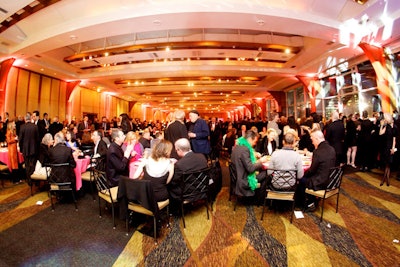 Bright lighting and patterned carpet; somehow for an invitation that boasted of Bette Midler, Manolo Blahnik, and Priscilla, Queen of the Desert, the reality was nebbishy.