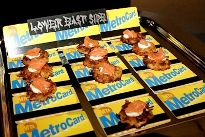 Matching the event's projections of city imagery, Marcey Brownstein Catering passed hors d'oeuvres on trays decorated with an array of iconic New York items.
