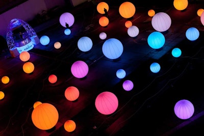 Created by London-based design firm Cinimod Studio, DJ Light is an interactive installation that allows guests to stand on a platform and control music and 85 color-changing globes with the wave of a hand. A software program on the platform detects a person’s movements, which triggers the LED-lit globes and sound system, creating a striking, rainbowlike effect.