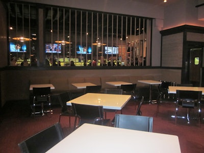 Remick's main dining area is separated from the bar and lounge by a slatted window.