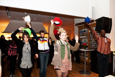 Posing as guests, dancers in hats of Pixie machine colors formed a flash mob during the event.