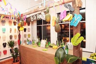 Bedecked with the brand's colorful flip-flops, the stations throughout the space took on a street market look. For instance, the bar, which served caipirinhas made with Leblon cachaça, was marked with a rugged-looking wood sign.