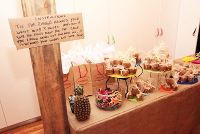 A table by the event's exit was stocked with mini upside-down pineapple cakes and Brazilian 'wish ribbons.'