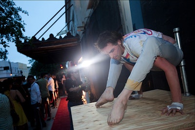 Organizers also created a small stage for a contortionist outside the party, to add to the sideshow feel.