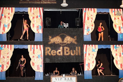 Dancers from Le Teaze Burlesque Troupe performed on a two-story stage divided into four cubes.