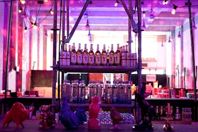 In the middle of the square bar, scaffolding topped with cantina lights held the liquor bottles.