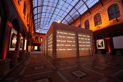 The building's soaring glass ceiling and exhibition of commissioned portraits of iconic families by Studio Harcourt provided an old-world backdrop for the event. To contrast this, Perrier-Jouët crafted a minimalist white cuboid for the dinner. Words of inspiration scrolled across the surface of the cube's walls for added effect.