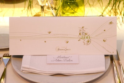 To give its bicentennial an identity, Perrier-Jouët created a unique logo and green-and-white color scheme that was used throughout the event. A bicentenary flute was also commissioned for guests to use during the dinner.