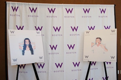 A W-branded step-and-repeat was flanked by NOH8 celebrity images.