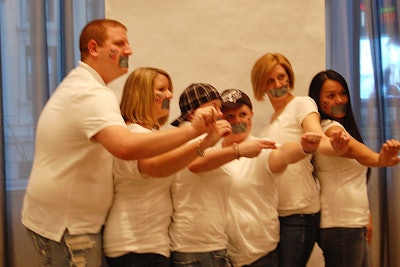 Guests posed with the campaign's signature trappings: duct tape over their mouths and 'No H8' scrawled on their cheeks.