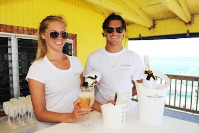 Shiraz Catering staff welcomed guests to the wooden home on stilts with goblets of Moët Ice Imperial.