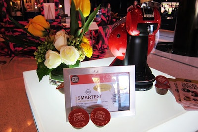 The Dolce Gusto machines were displayed on illuminated tabletops alongside flowers, to underscore their design-y look.