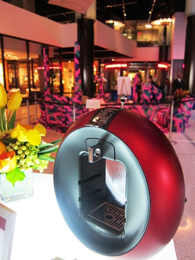 The four types of Dolce Gusto machines sat atop tables along with product information and flowers.
