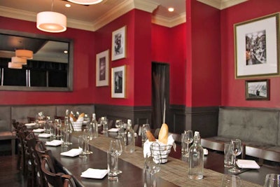 At Bistronomic, Paris-inspired touches include paper-wrapped baguettes and black-and-white photos of the City of Lights.