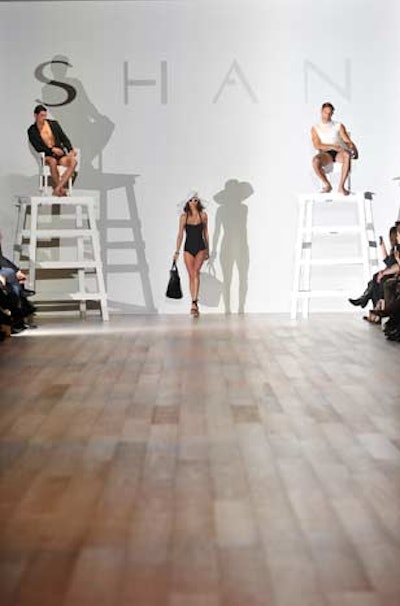 Shan got the crowd in the main runway space thinking about summer by showing off their couture swimwear on the models walking the runway and those peering down from lifeguard chairs.