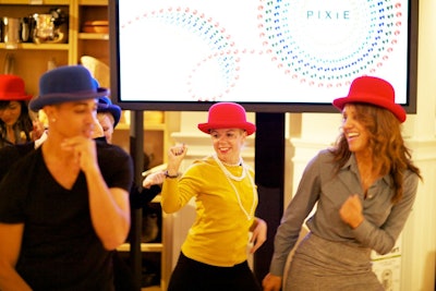 Flash-mob performers wore colorful bowler hats in a nod to the machines.