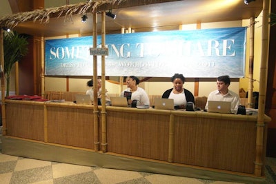 The tropical theme for the Dress for Success gala started at Pier Sixty's entrance, with registration desks inside beach huts. The creative team at Bobbi Brown Cosmetics came up with the concept for booths, structures made by SBI from bamboo paneling, thatched roofs, and hand-painted wooden signs.