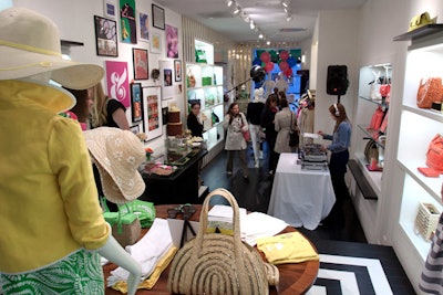 The event took place at the Kate Spade store on Oak Street. In the store window, festive mannequins clutched bundles of balloons.