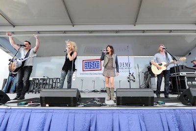 Jimi Westbrook, Kimberly Schlapman, Karen Fairchild, and Phillip Sweet of Little Big Town performed at the second annual Academy of Country Music U.S.O. Concert at Nellis Air Force Base.