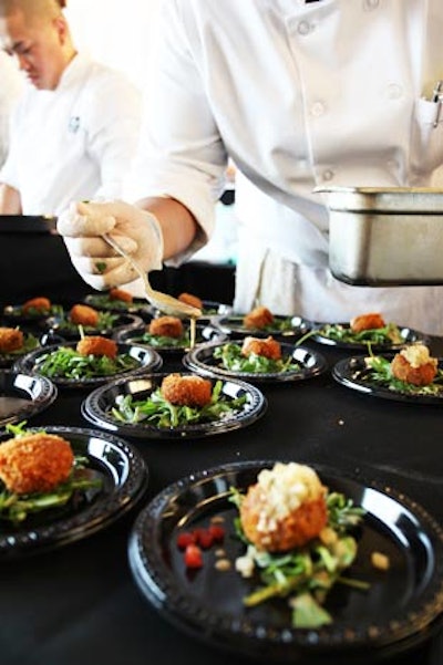 Emeril Lagasse's Tchoup Chop restaurant served panko-crusted pork galette with a spicy pear chutney and mustard coriander vinaigrette over arugula.