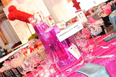 Design Cuisine Caterers used hot pink and silver linens to decorate the dinner tables.