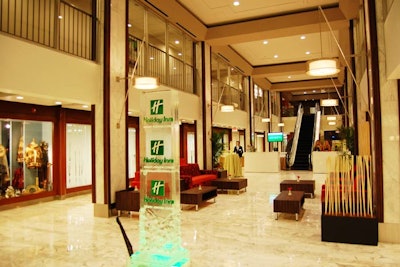 Renovations included building glass panels around the second floor to overlook the white-marbled lobby.