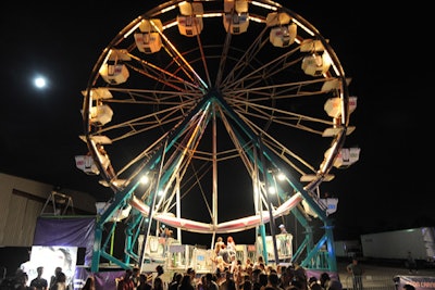 A logoed Ferris wheel towered over the A|X and 944 Neon Carnival.