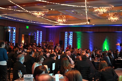 Blue uplighting and overhead twinkling lights echoed the starry-sky theme seen in signage, invitations, and programs.
