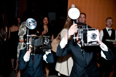 Actors dressed as old-time paparazzi made their way through the museum.