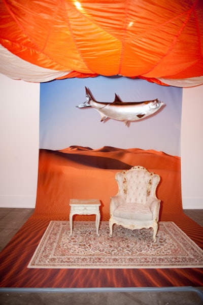 In the Surrealist parlour, guests posed in a Sahara-desert setting beset with flying fish.