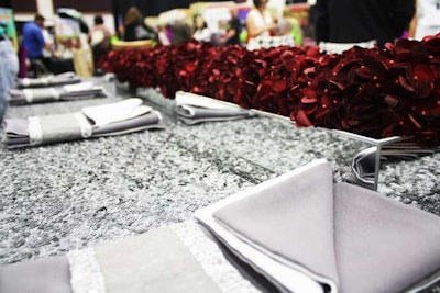 Nuage Designs displayed its new taffeta sequin tablecloths, which come in several colors, including matte gunmetal.
