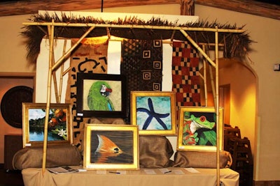 Grass huts and burlap tablecloths gave the silent-auction area the feel of an African market.