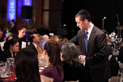 Servers from Spertus Kosher Catering Featuring Cuisine by Wolfgang Puck wore yarmulkes.