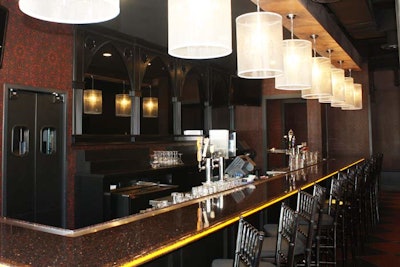 The long bar has a subtle glow from lights mounted underneath the poured resin.
