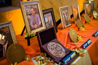 A display area showcased medals that were awarded in past years. Previous recipients have included Liberty Mutual, Delta, and Chrysler.