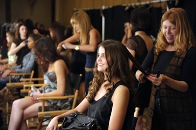 Models prepared for the runway show.
