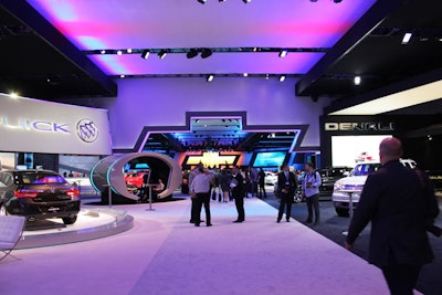 As a dramatic way to mark its booth in the pavilion, Chevrolet crafted a cutout entrance in the shape of its logo.