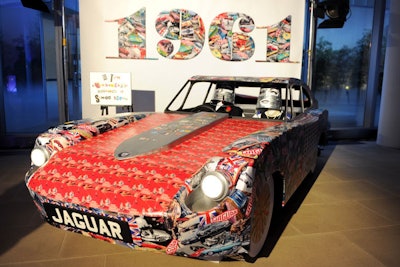 Instead of a step-and-repeat, Doonan's life-size wooden replica of the E-Type sports car decorated with a decoupage of 1960s imagery served as the backdrop for red-carpet photos.
