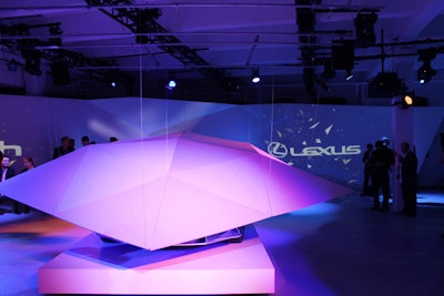 At Center548 on April 19, a wash of purple lighting and angled walls marked the debut of the Lexus LF-Gh hybrid concept car.