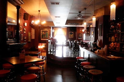 Bayou's second floor has a variety of high-top and traditional seating and is decorated with various styles of crystal chandeliers and posters of New Orleans imagery.