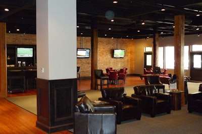 Leather furniture fills staggered lounge areas.