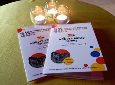 The invites, programs, and on-site decor all combined the Wonder Bread colors of yellow, blue, and red.