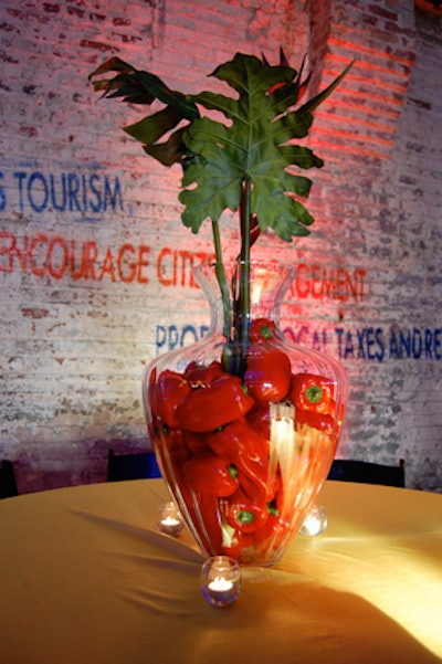 Large vases filled with fruits and vegetables like lemons and red peppers served as centerpieces for the tables in the V.I.P. area.