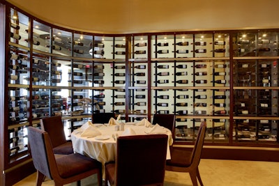 Enclosed by glass wine cases, the private dining room seats 45 guests.