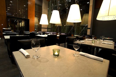 Contemporary design and Art Deco touches blend in Victor's main dining area.