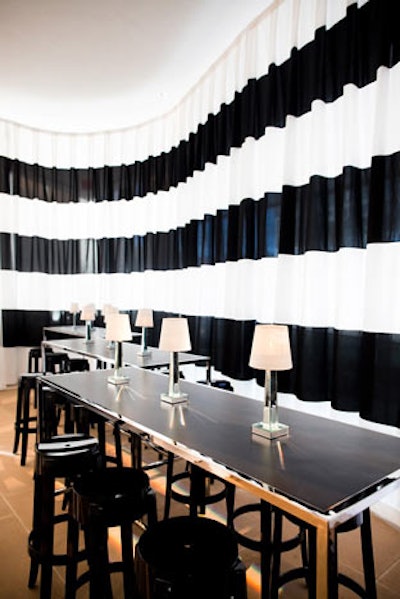 A horizontally striped black and white drape formed a striking backdrop at the far end of the west lobby.