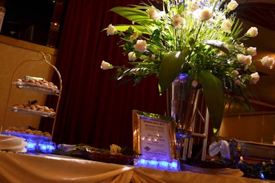 Bunches of white roses accented the buffet tables, which offered British-style treats such as shortbread cookies.