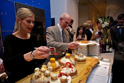 All-Clad's Sonya Latreille helped decorate the 40th anniversary cake.