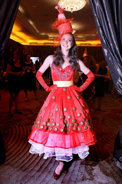 Miss Sweet Charity, a.k.a. Kate Michael of social blog K Street Kate, mingled with guests during the two tasting hours before the fashion show, her dress adorned with chocolate cookies.