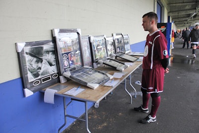 To help raise money for youth soccer programs, the organizers of the N.Y.F.E.S.T. held a silent auction set up on tables around the perimeter of the soccer pitch.